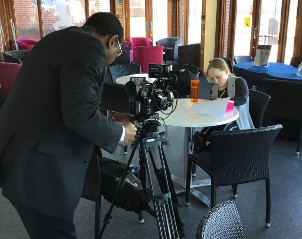 BBC film crew interviewing Norhtampton High School student working on a round table.